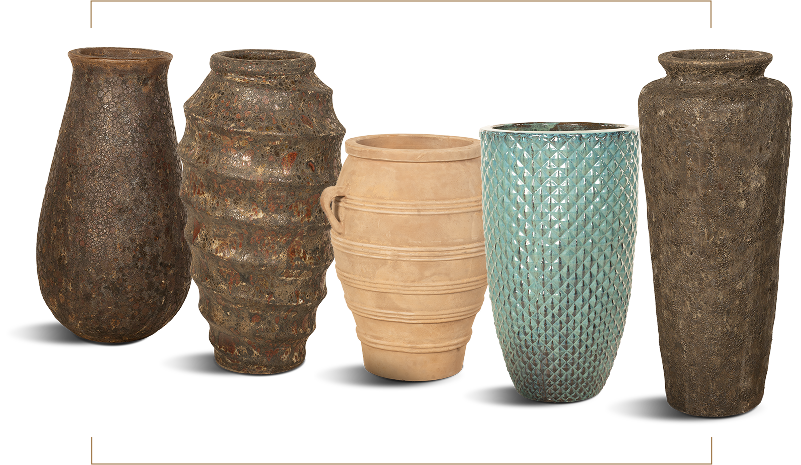 Five tall decorative vases in a row, each with a unique texture and finish.